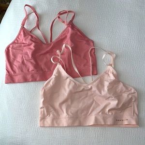 Light and dark pink bralettes